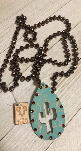 Crackle wood cactus cutout charm on brown beaded necklace